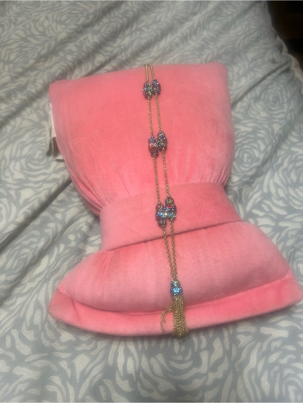 Pink Velvet Jewelry Display with Sparkling Gold Tassel Necklace
